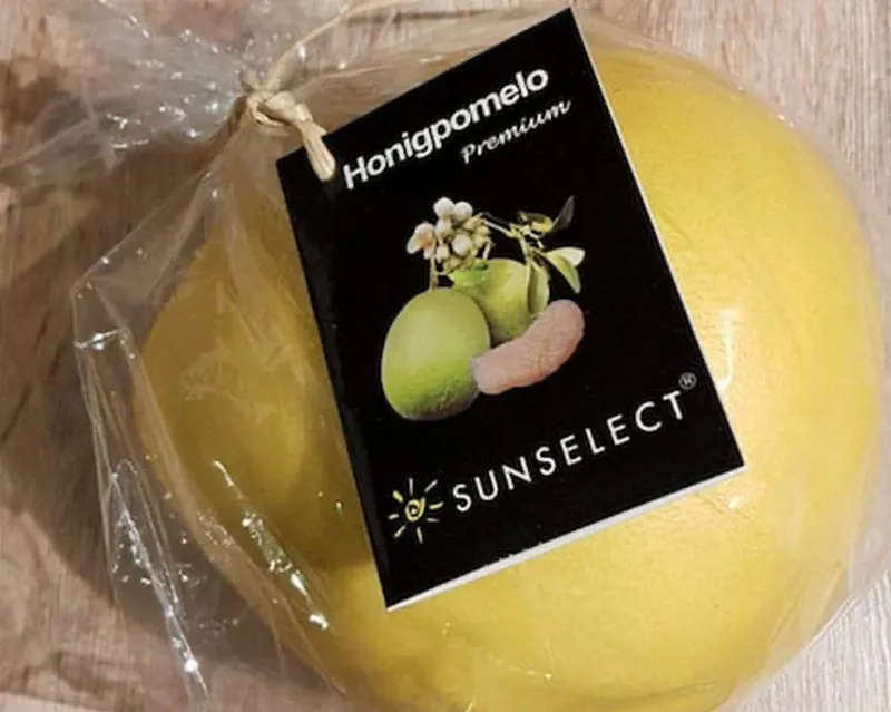 Unnecessary plastic packaging for a honey pomelo