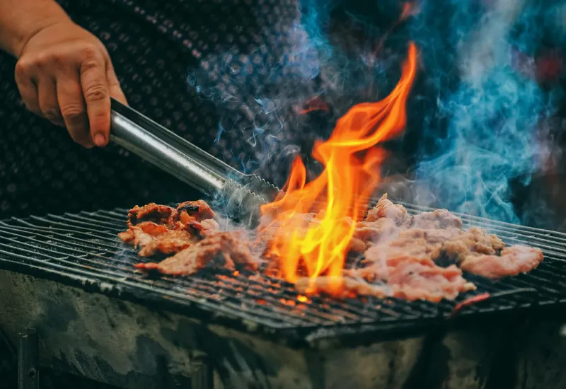 A man grills meat