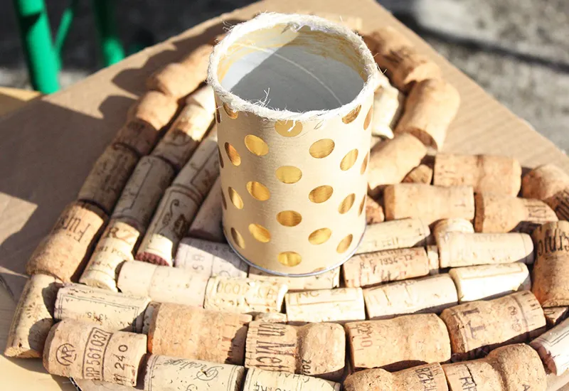 A DIY lantern on a coaster made from wine corks